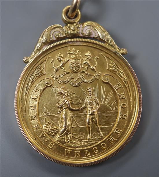 A 9ct gold Lydneys Welcome Home medallion to J. Watts, hallmarked for Birmingham, 1918, 10.6 grams.